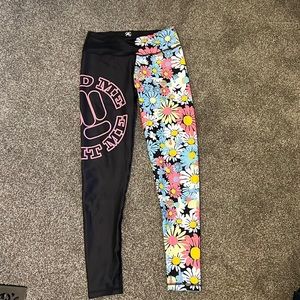NWOT Feed me fight me black and flower multicolored pants. Never worn